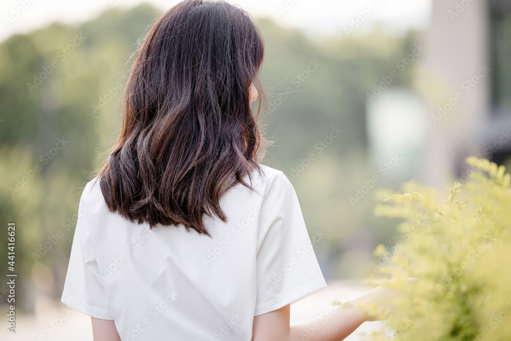 Outdoors, pretty beautiful Asian female college student