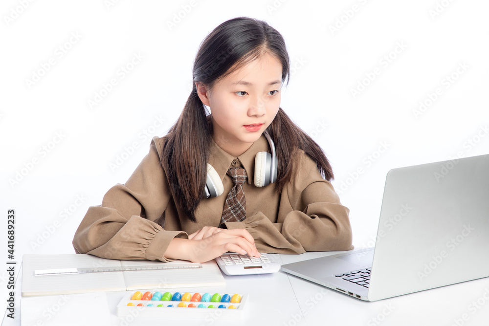 Little Asian girl receiving online education on white background