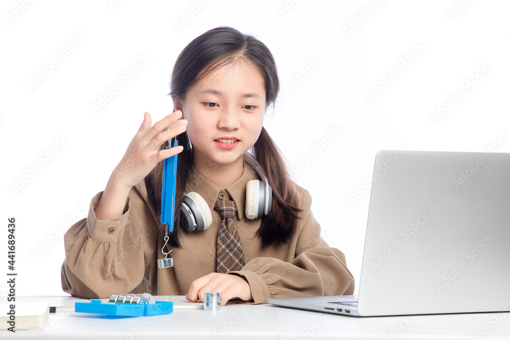 Little Asian girl receiving online education on white background