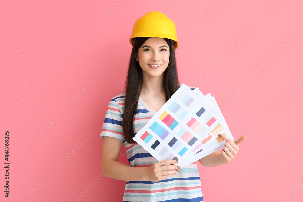 Young woman with palette samples on color background