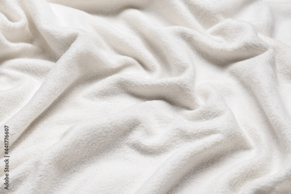 Texture of white fluffy fabric, closeup