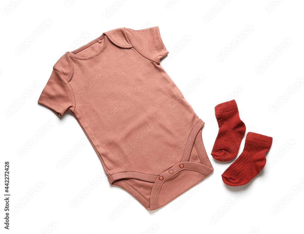 Baby clothes and socks on white background