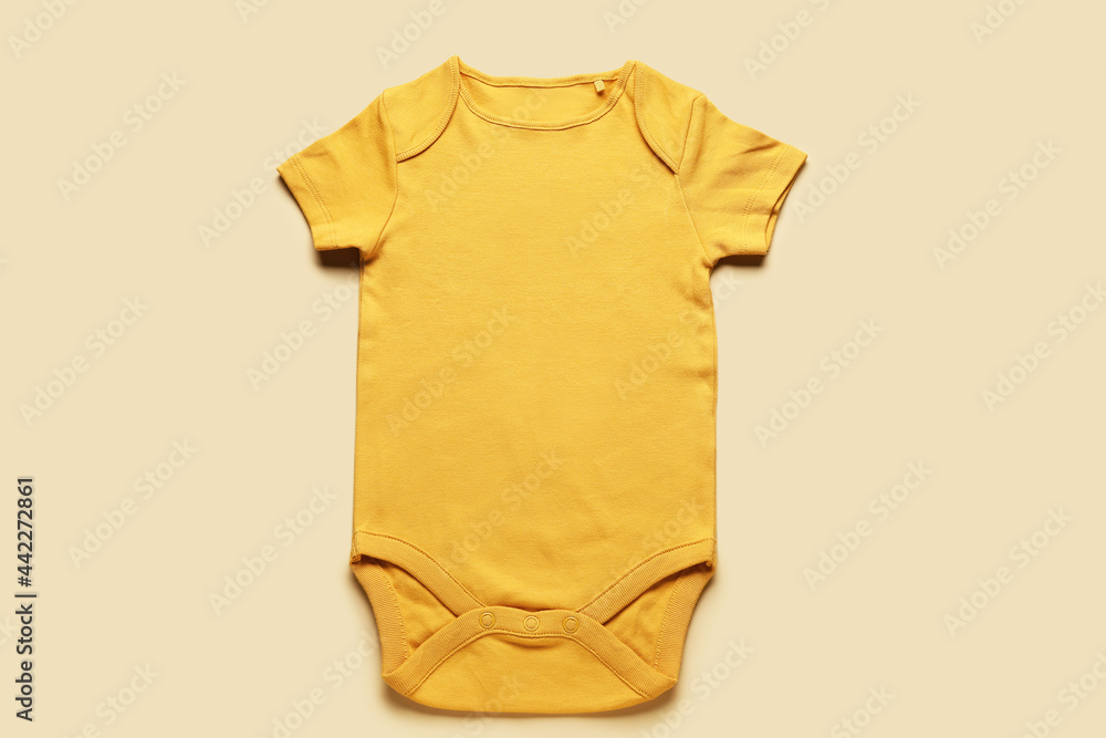 Baby clothes on color background