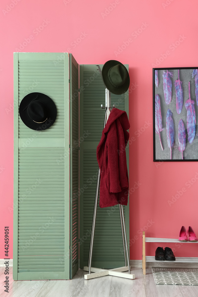 Interior of stylish hallway with modern folding screen