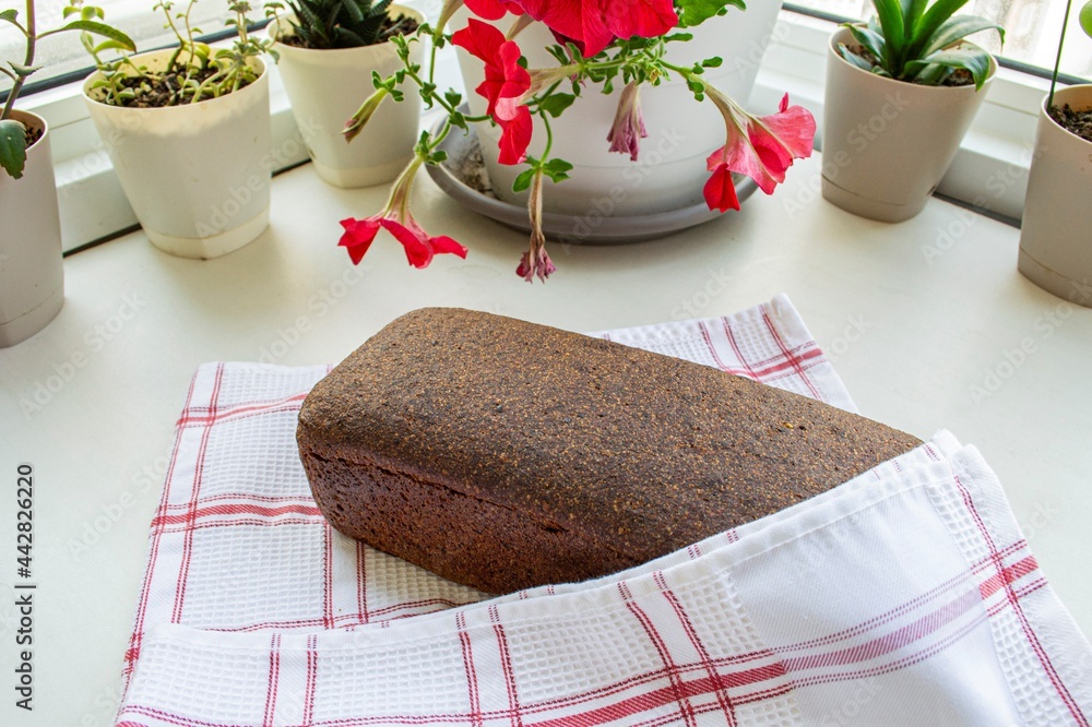 Loaf of fresh rye bread. Home kitchen