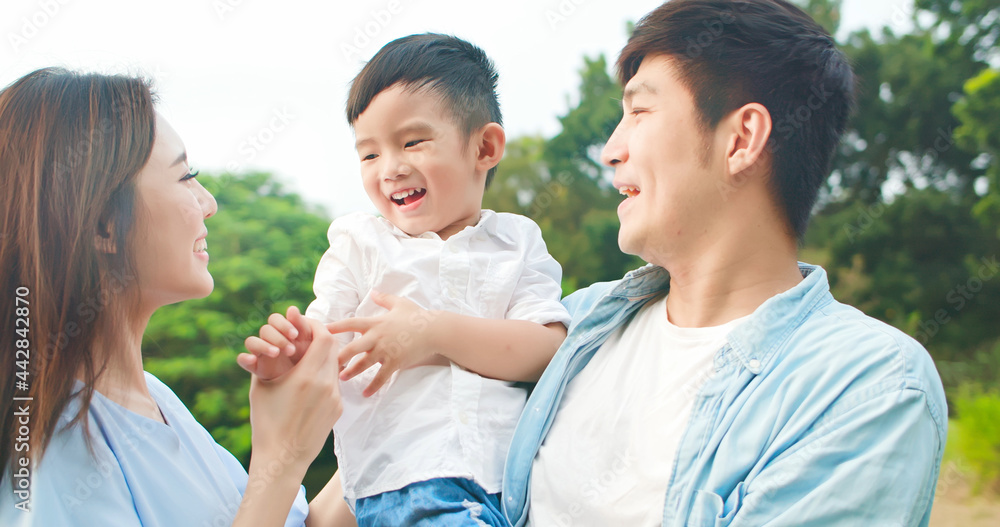 asian family happily in park