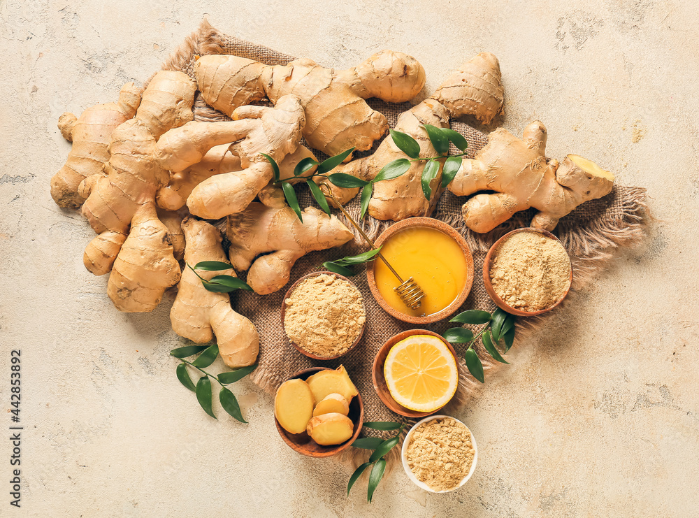 Composition with ginger, honey and lemon on color background