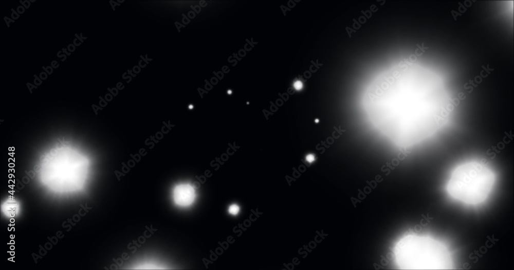 Image of glowing white spots of light moving in hypnotic motion on black background