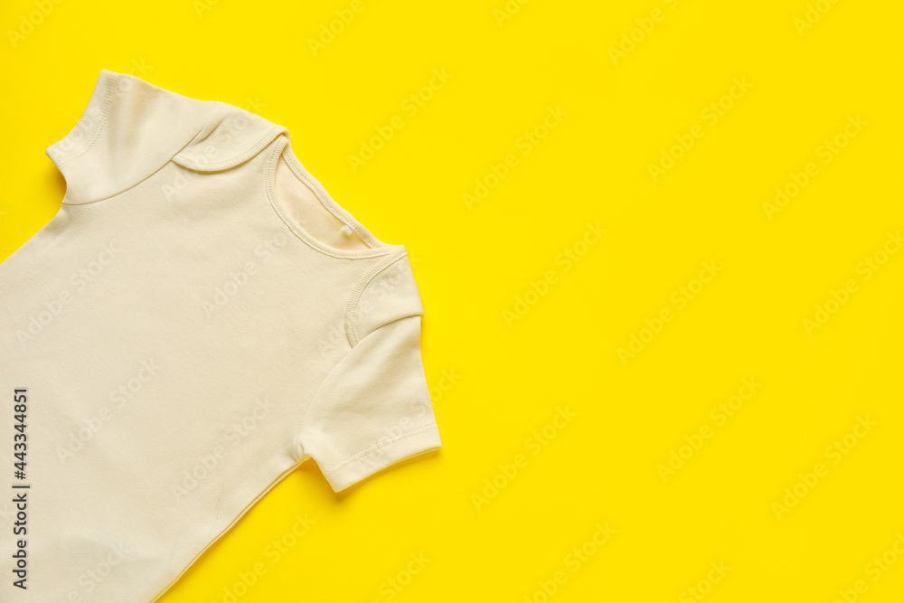 Baby clothes on color background