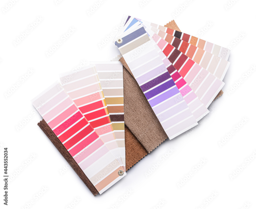 Paint color palettes and fabric samples on white background