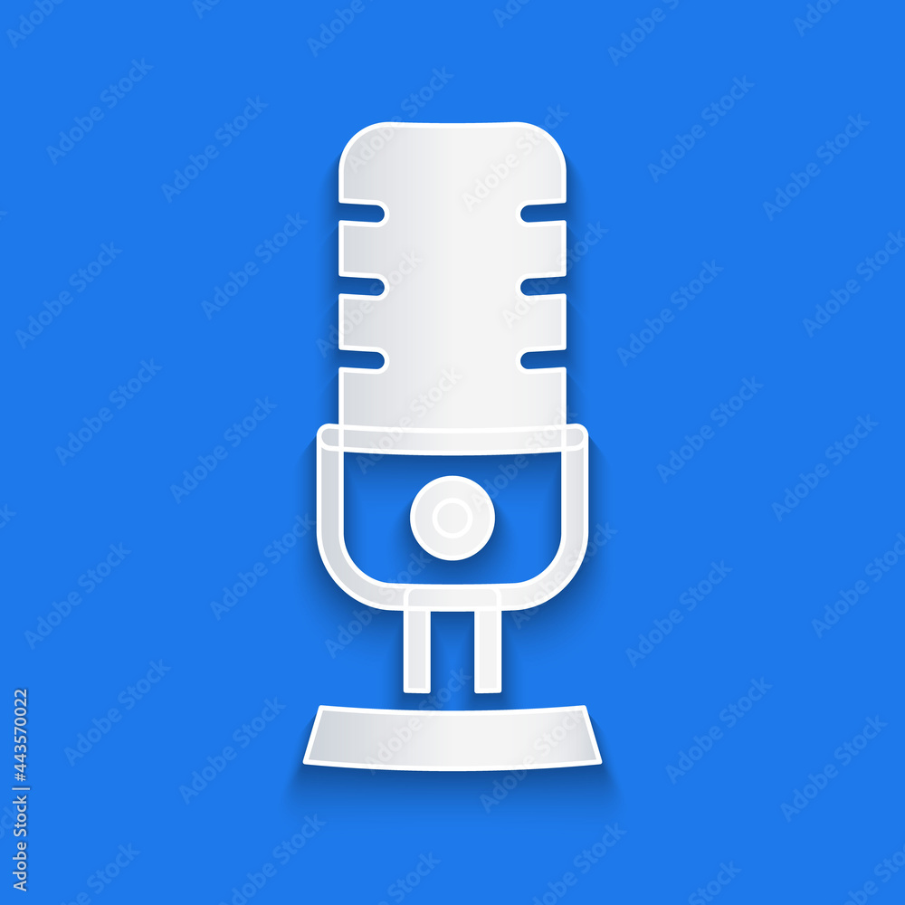 Paper cut Microphone icon isolated on blue background. On air radio mic microphone. Speaker sign. Pa