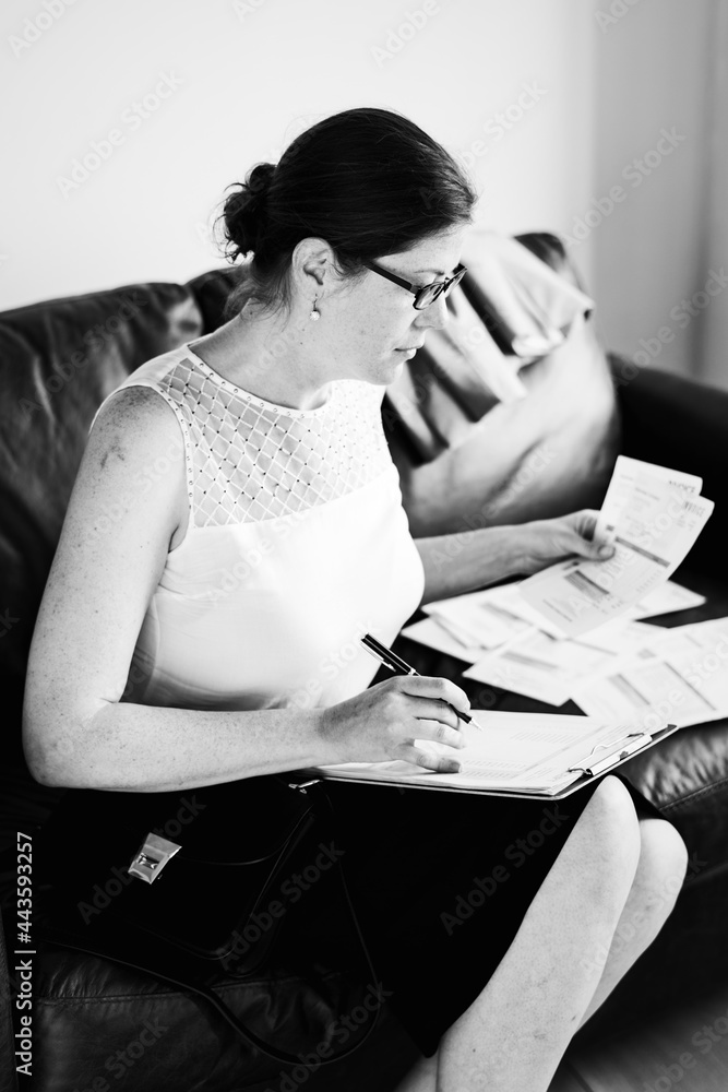 Businesswoman working on a couch