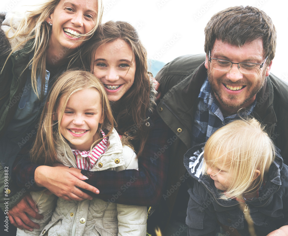 Group of happy family hugging each other