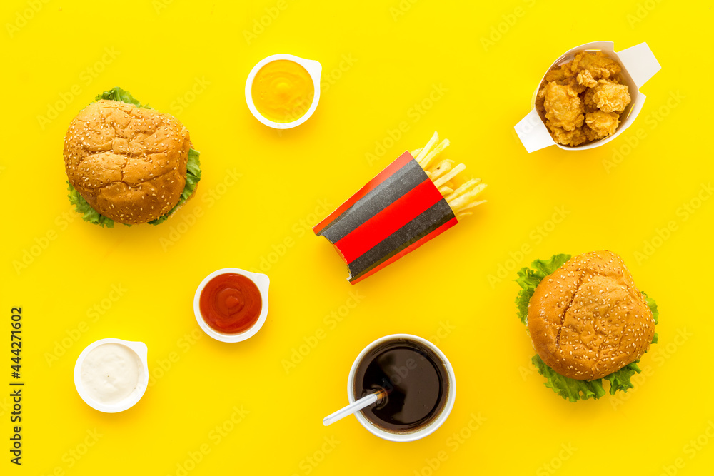 Fast food set. Hamburger and fries with sauces - takeaway