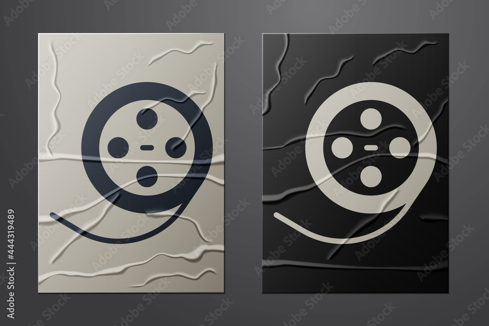 White Film reel icon isolated on crumpled paper background. Paper art style. Vector