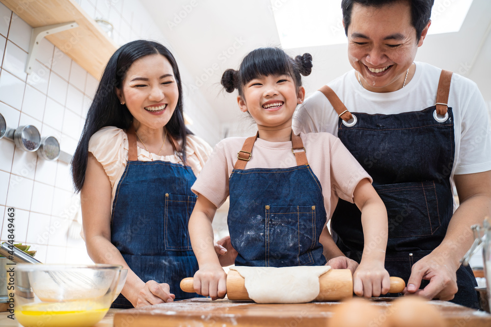 Asian happy family stay at home in kitchen, baking bakery and foods.