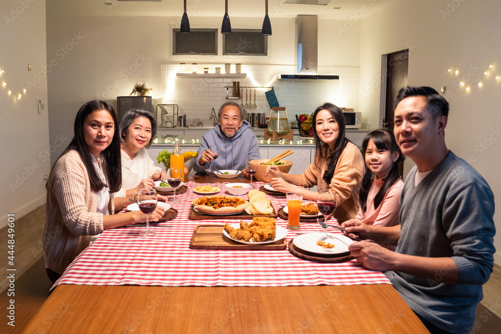 Portrait of Asian Big happy family having dinner together in house.