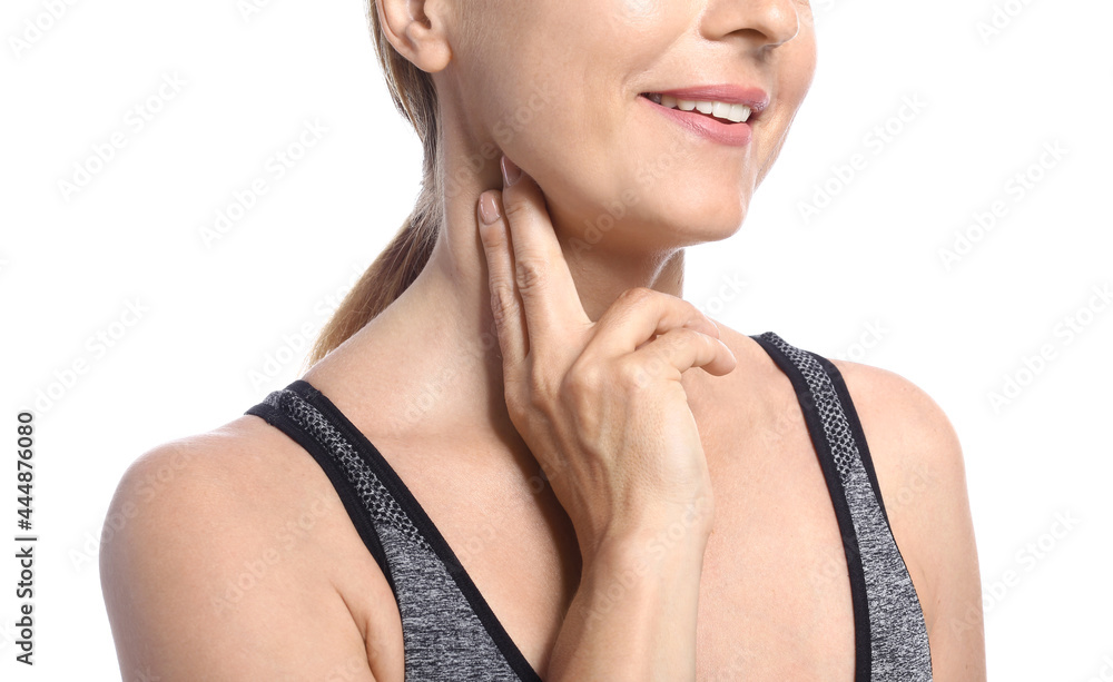 Female runner checking pulse on white background