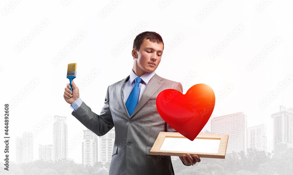 Creative businessman painter holding paintbrush