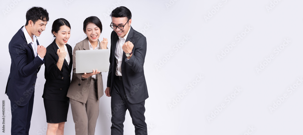 Group of Asian business people posing on a white background