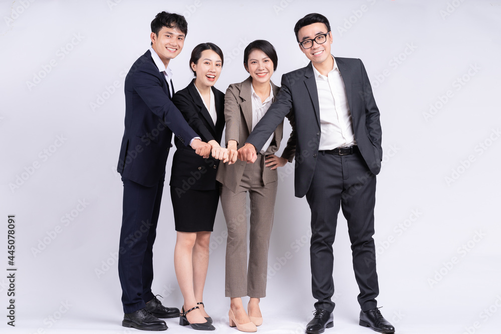 Group of Asian business people posing on a white background