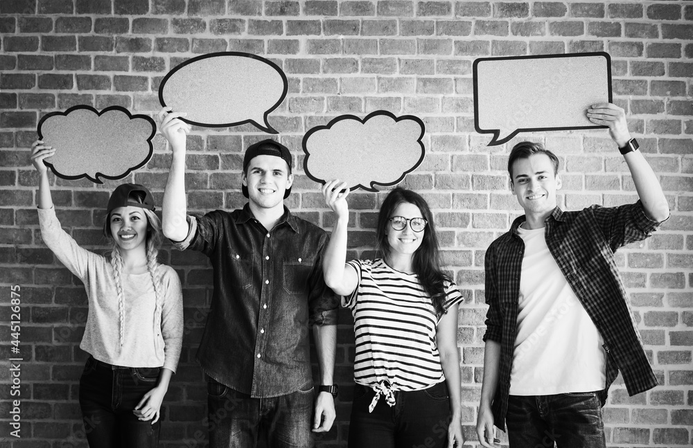 Happy young adults holding up copyspace placard thought bubbles