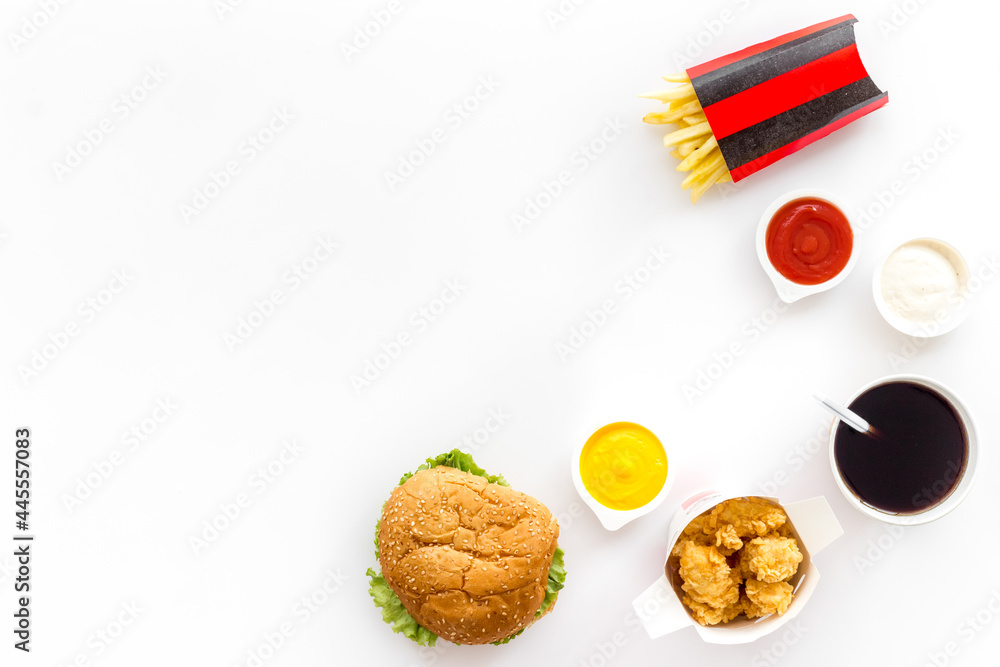 Junk fat food snack - french fries and burger, top view