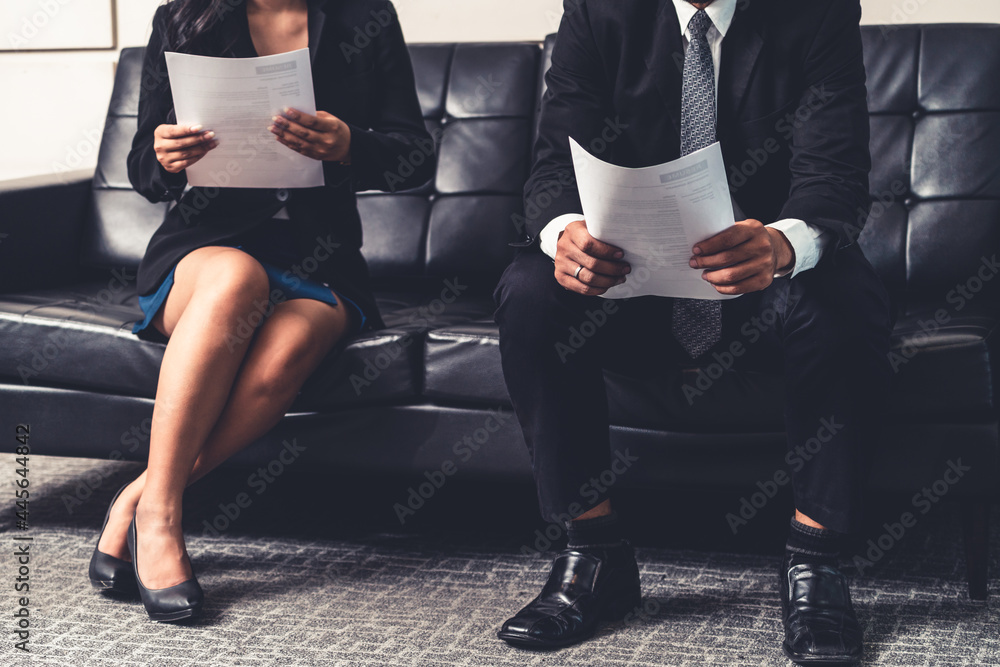 Stressed businessman and businesswoman candidate sit and wait for interview at the company office. J