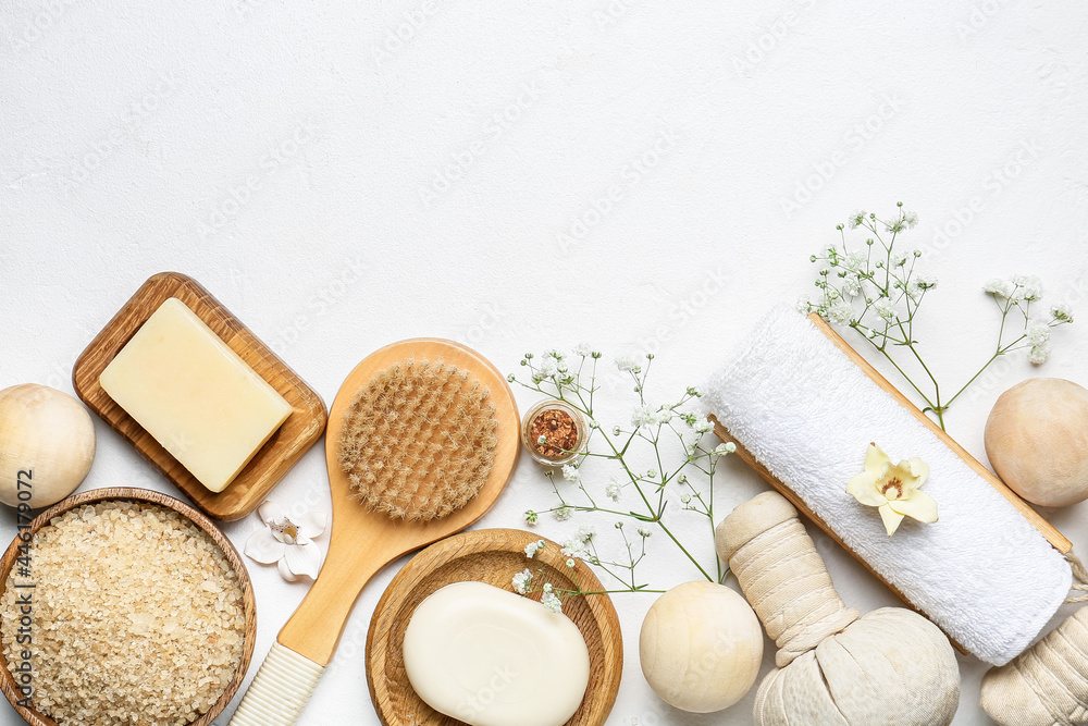 Beautiful spa composition with flowers on light background