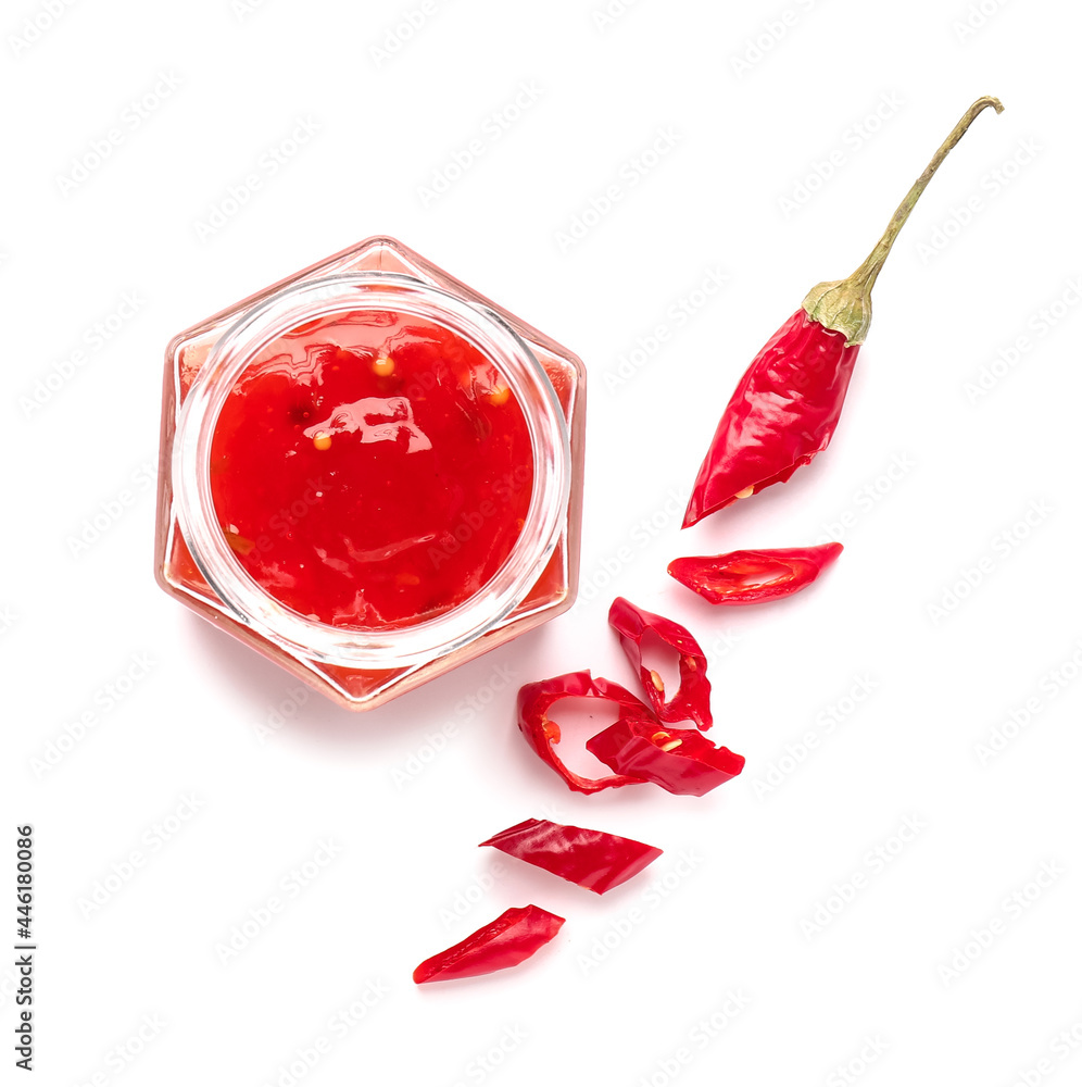 Jar of chili sauce on white background