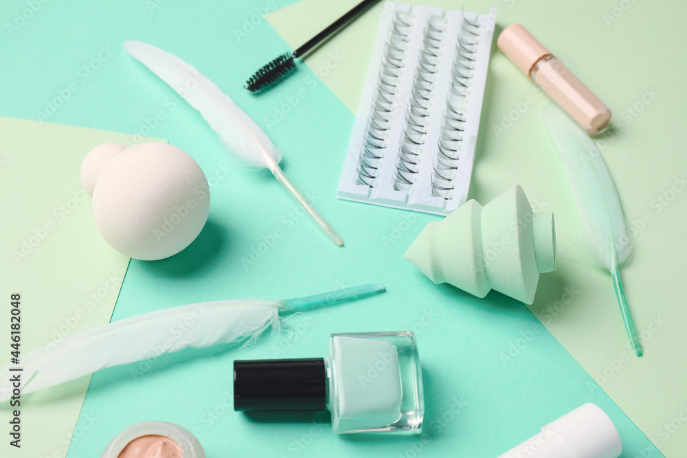 Makeup supplies on color background