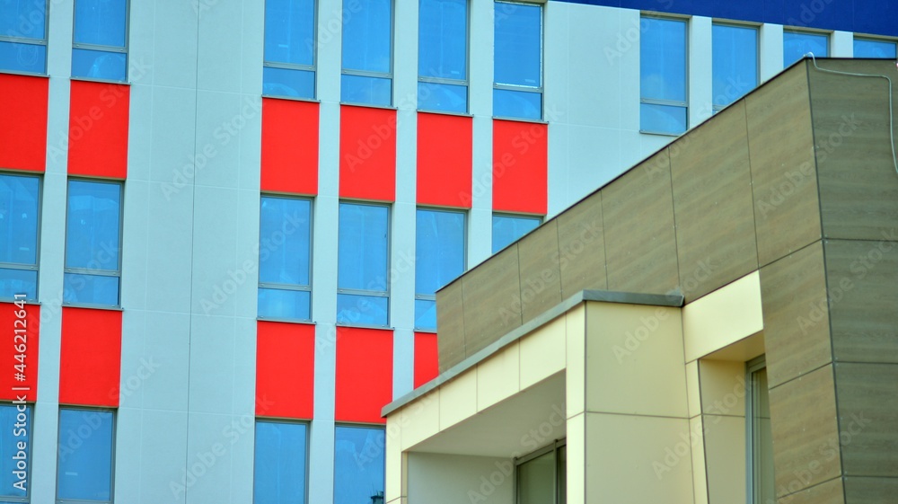 The glazed facade of an office building with reflected sky. Modern architecture buildings exterior 