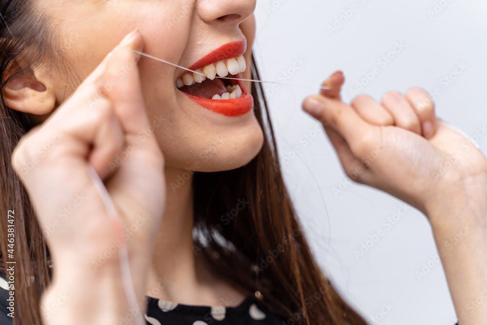 Beautiful young woman teeth treatment. Close up dental healthcare.