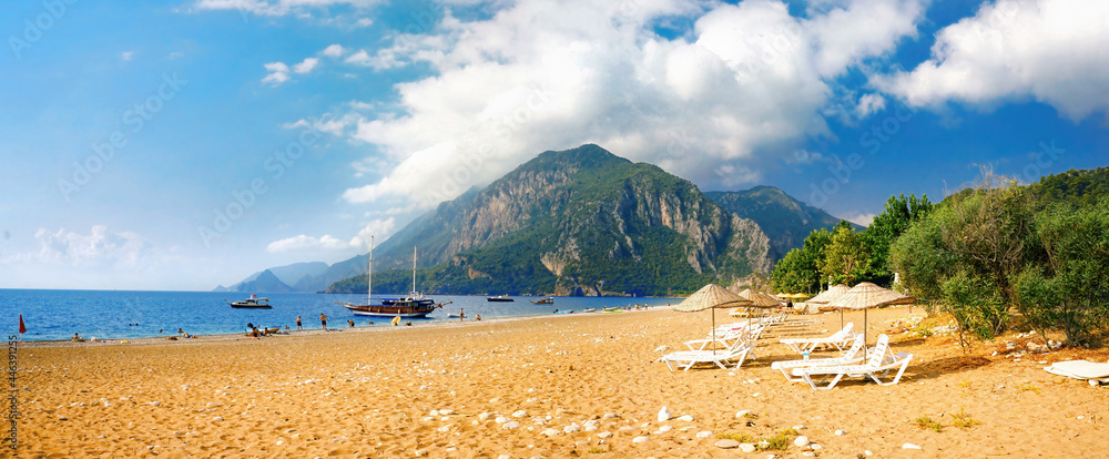 Beautiful panoramic view of sea and beach Cirali, Kemer, Antalya, Turkey. Mountains and blue sky wit