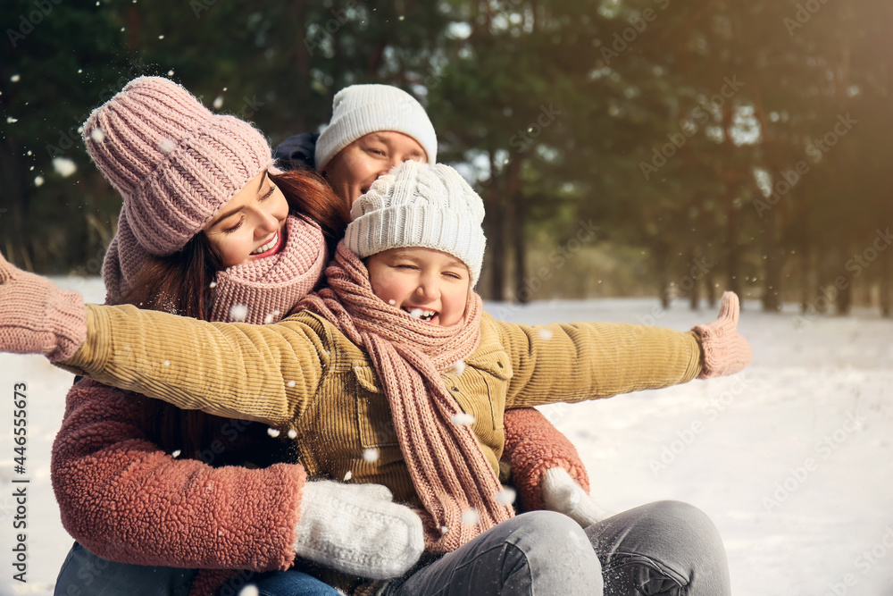 Happy family in park on winter day