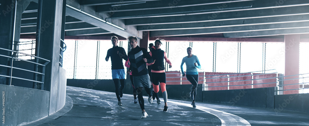 Young people in sportswear running