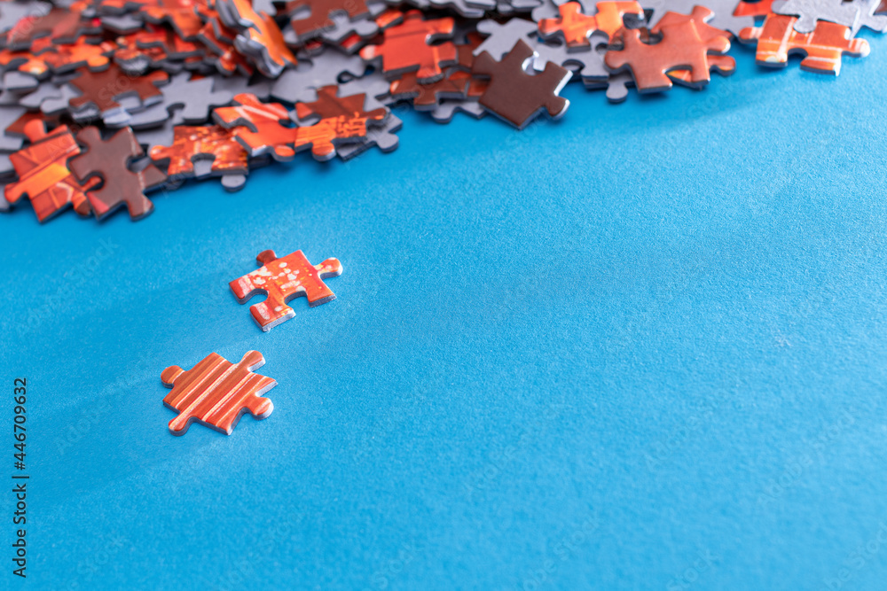 Mixed Peaces of a Colorful Jigsaw Puzzle Lie on the Blue Background - Strategy and Solving Problem C