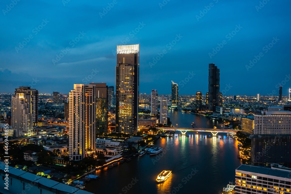 Night cityscape and high-rise buildings in metropolis city center . Downtown business district in pa