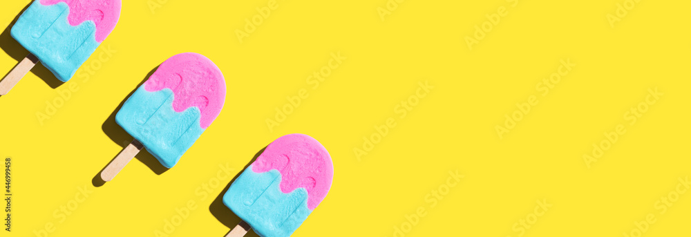 Pink and blue popsicles with shadow