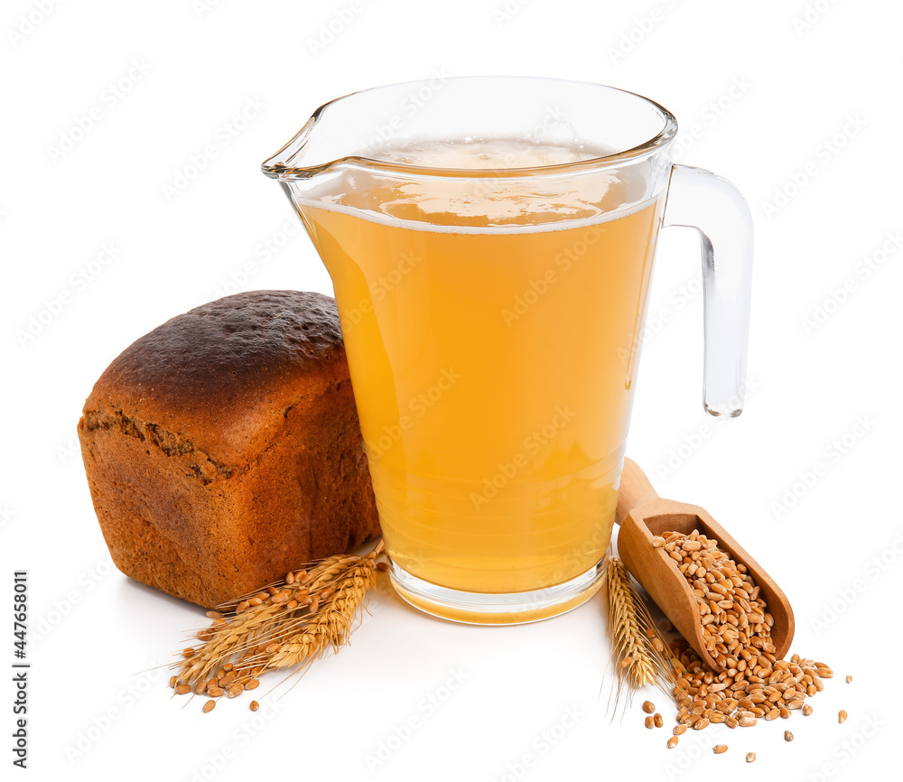 Jug of fresh kvass on white background