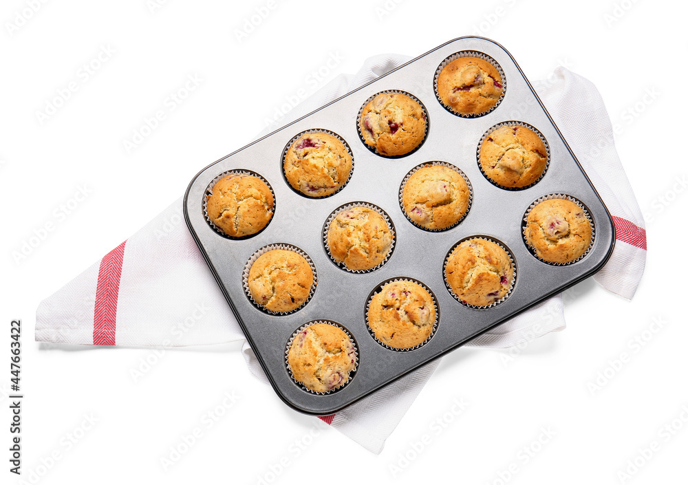 Baking tin with tasty raspberry muffins on white background