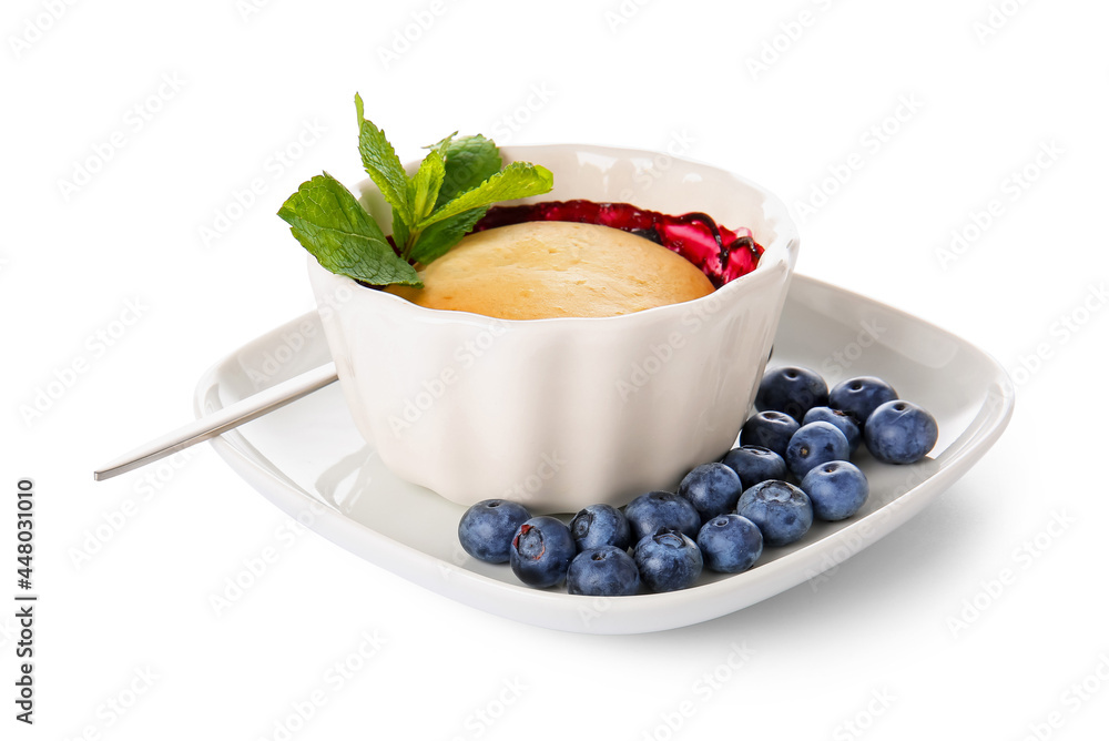 Ramekin with blueberry cobbler on white background