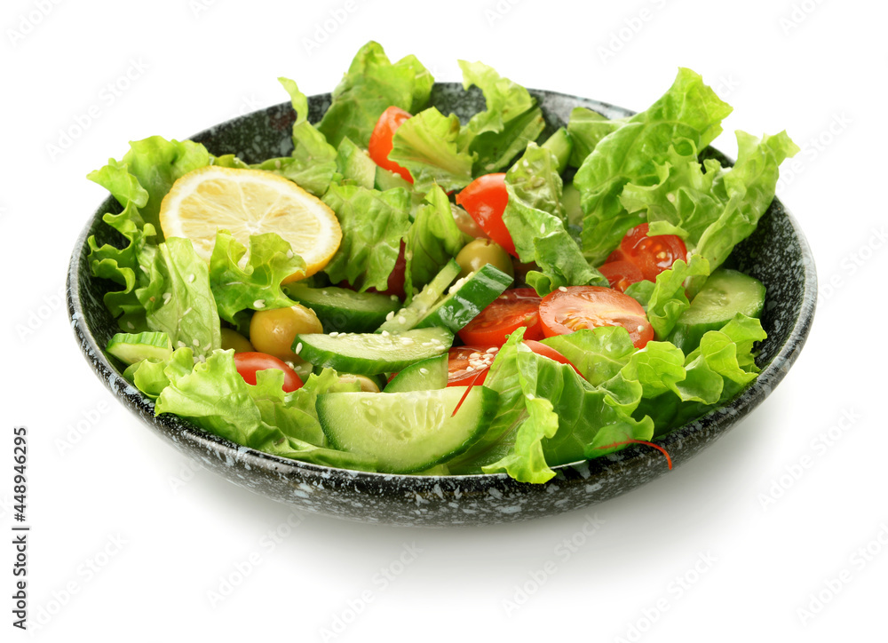 Plate with mixed vegetable salad on white background