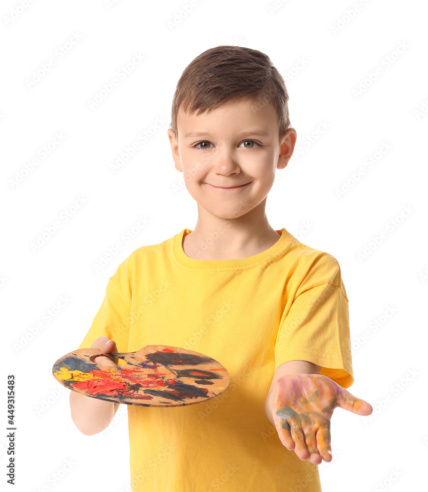 Cute little boy with paint palette on white background