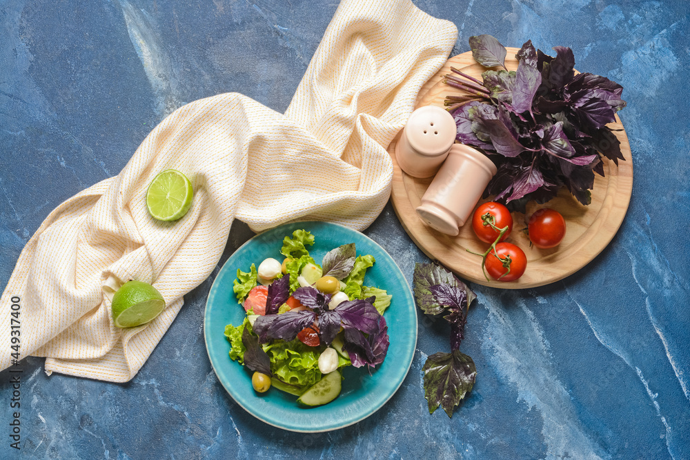 Composition with tasty fresh salad and spices on color background