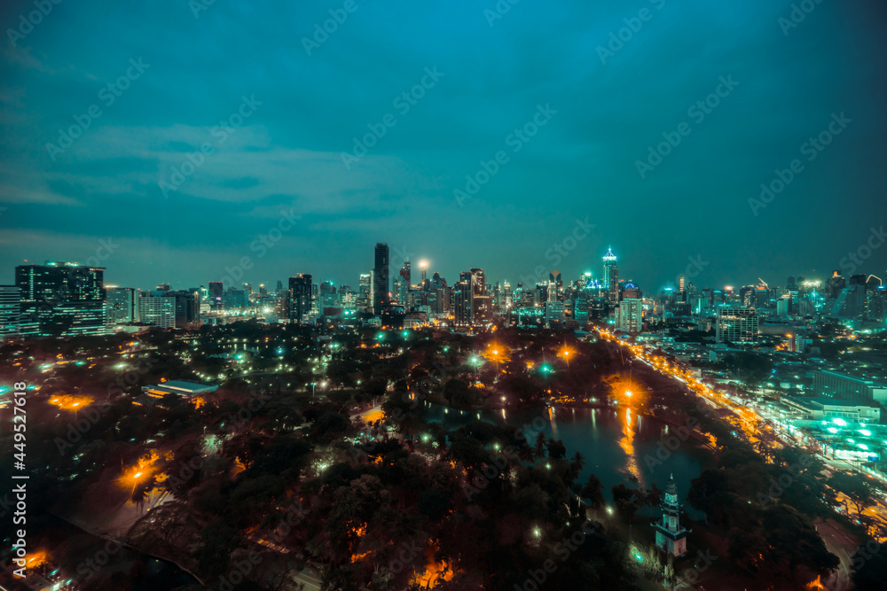 Night cityscape and high-rise buildings in metropolis city center . Downtown business district in pa