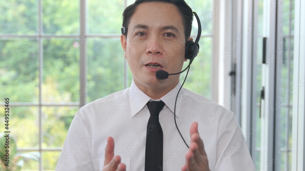 Video call camera view of businessman talks actively in videoconference . Call center, telemarketing