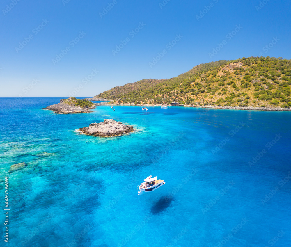 Aerial view of beautiful yacht on the sea at sunny day in summer. Akvaryum koyu in Turkey. Top view 