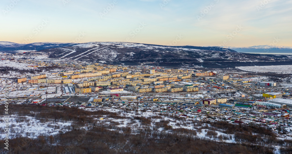 City block panorama. Aerial view of the Russian northern city of Magadan. Top view of the streets an