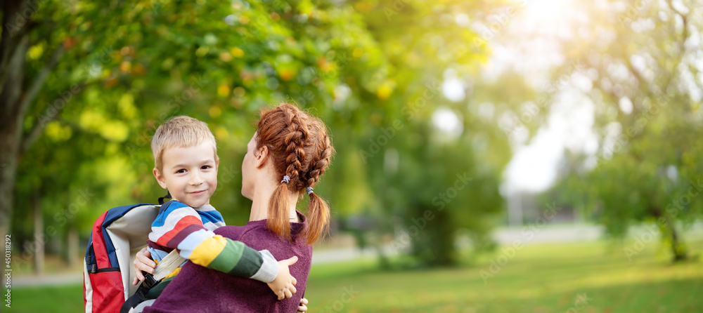 Mother meeting her son from primary school.